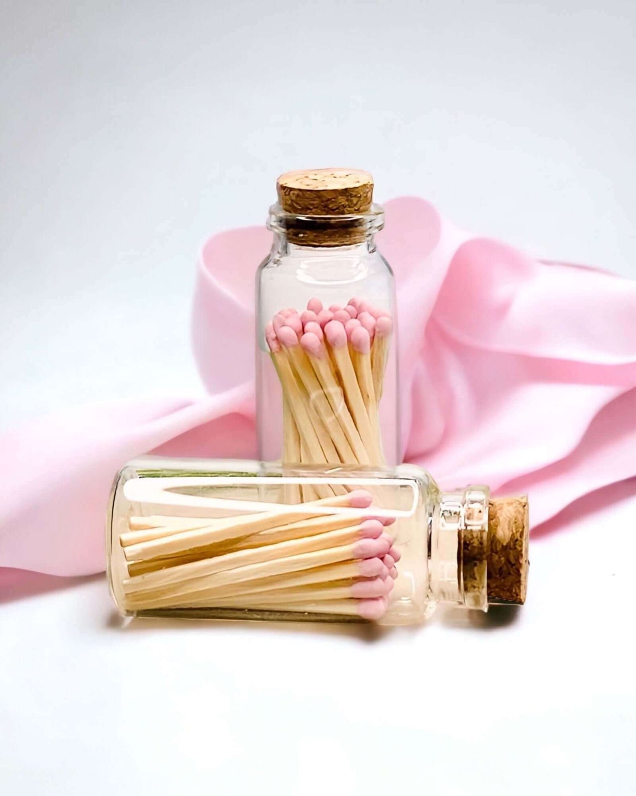 Stylish baby pink multicoloured matches come in a mini apothecary jar