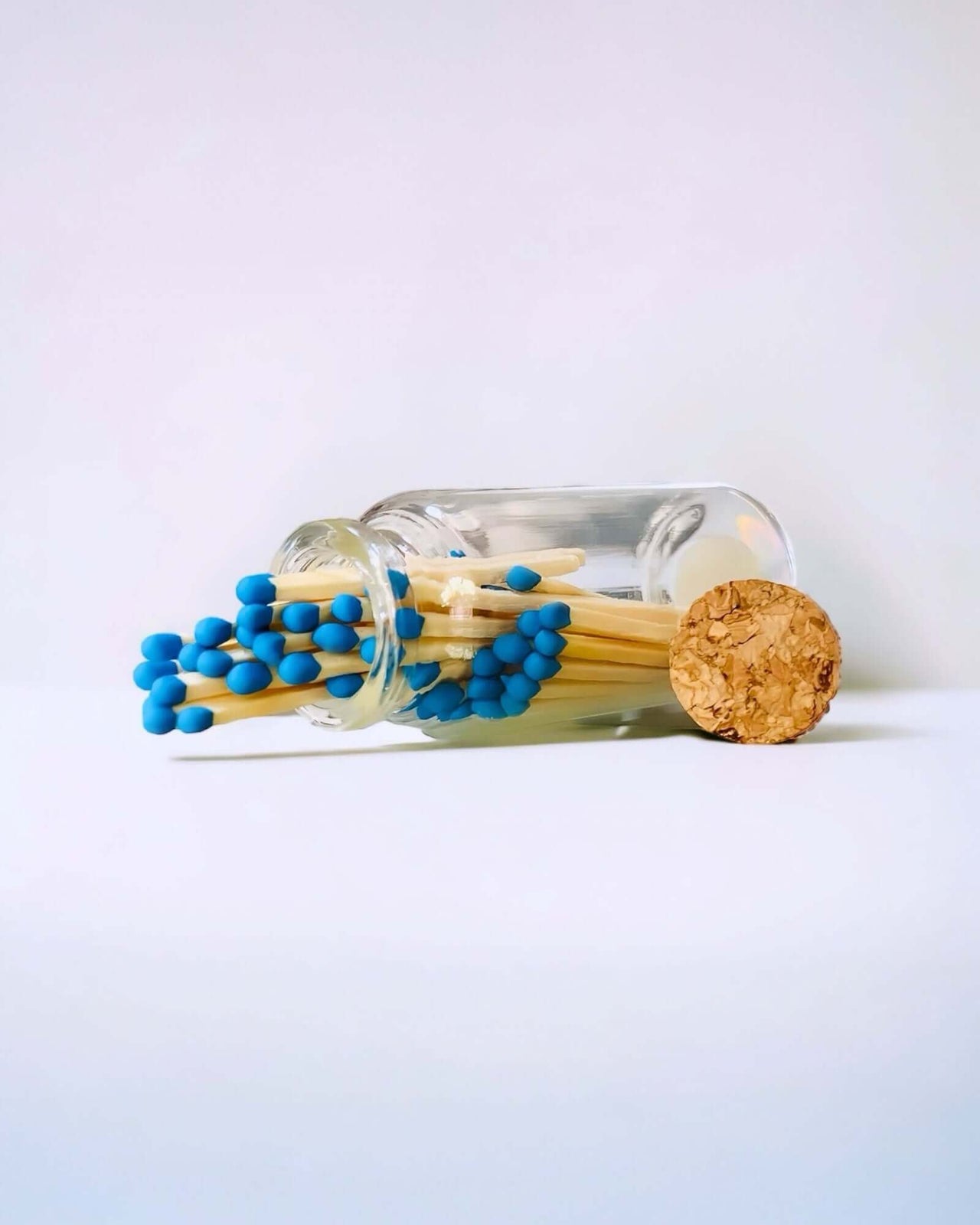 Stylish blue multicoloured matches come in a mini apothecary jar