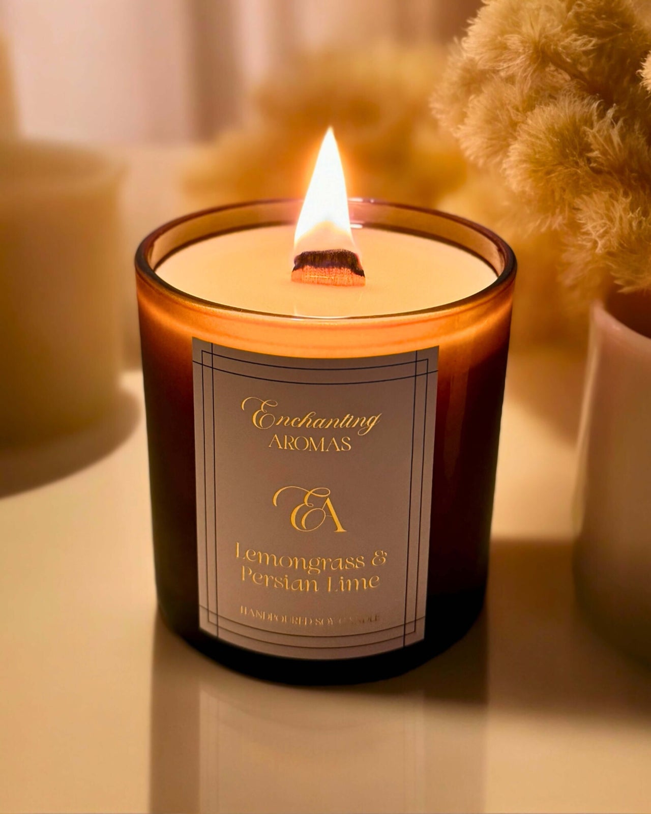 Luxe Winterwood Candles: Signature Home Fragrances with a wooden wick encased in a frosted amber jar