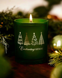 Thumbnail for Enchanting Aromas Christmas Candle, a forest green jar and topped with a chic bamboo lid.