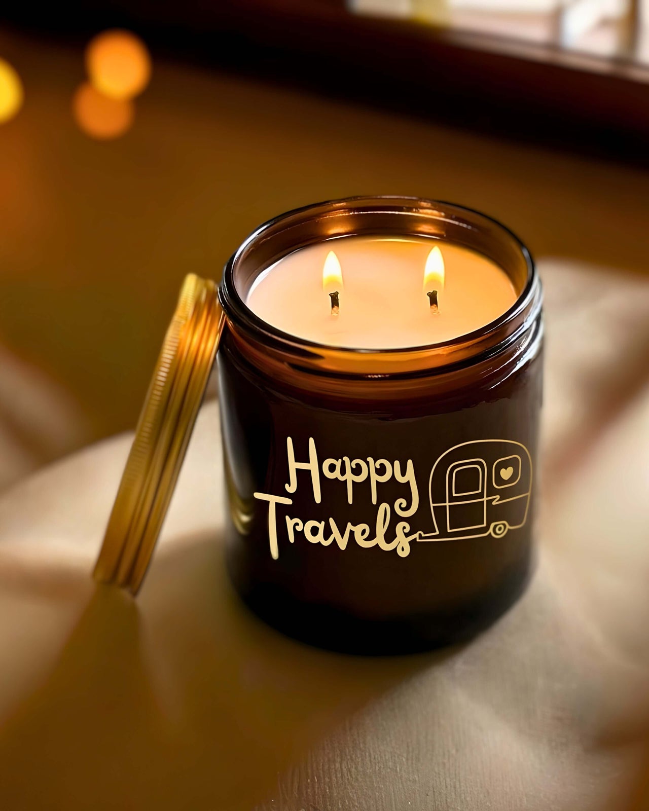 Say farewell with our Happy Travels Candle, encased in elegant amber glass jars, each candle is adorned with a delicate gold caravan and the heartfelt words ‘happy travels’.