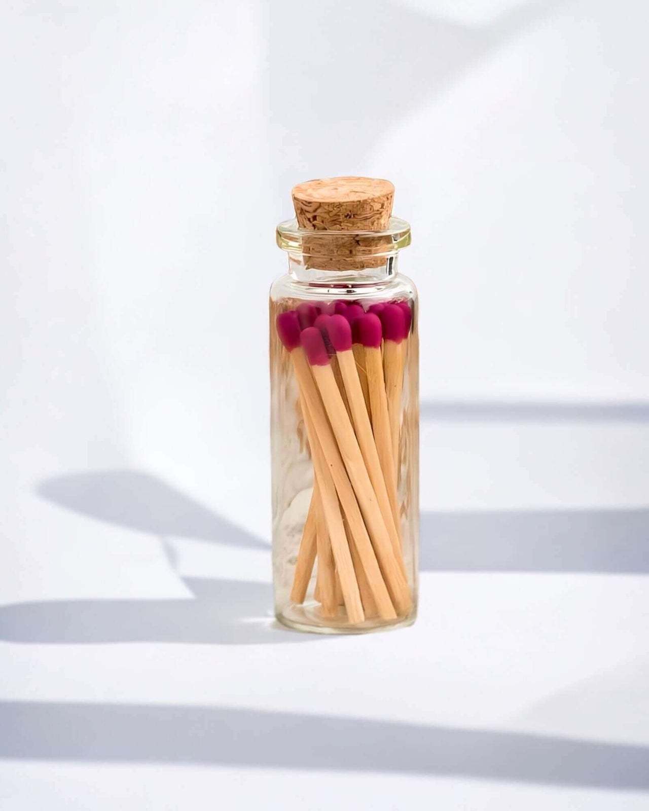 Stylish magenta multicoloured matches come in a mini apothecary jar