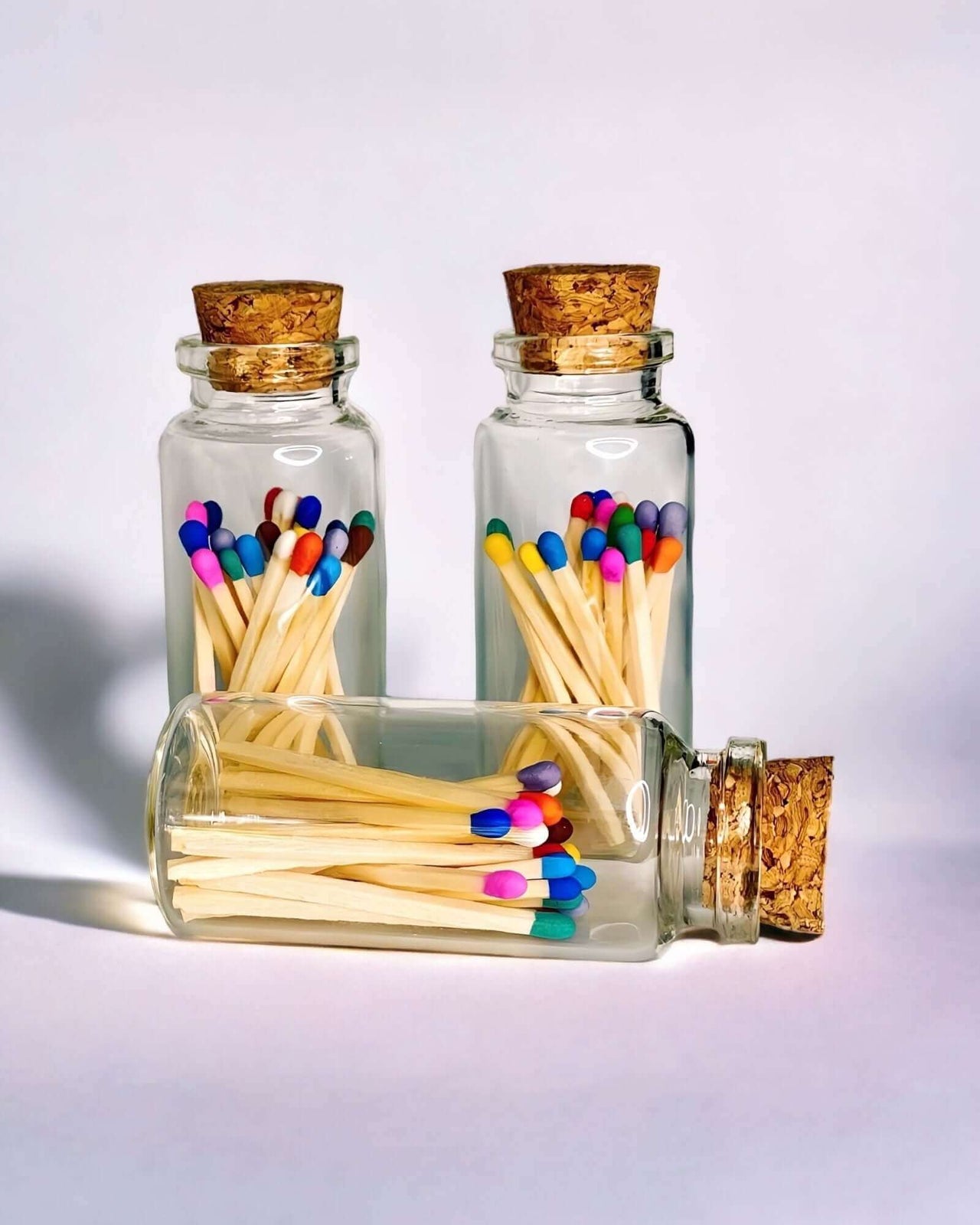 Stylish multicoloured matches come in a mini apothecary jar