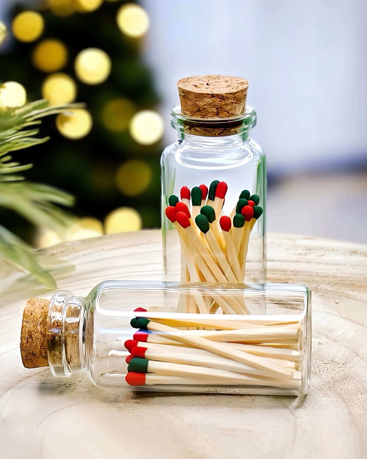 Multicoloured red and green matches in a mini apothecary jar for Christmas.