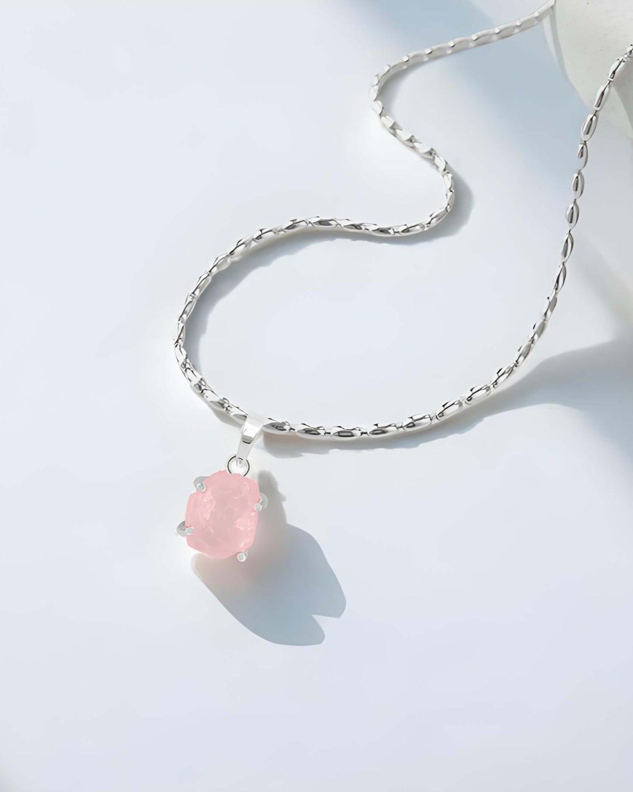 Experience the power of love and positivity with our stunning Raw Rose Quartz Pendant Necklace.