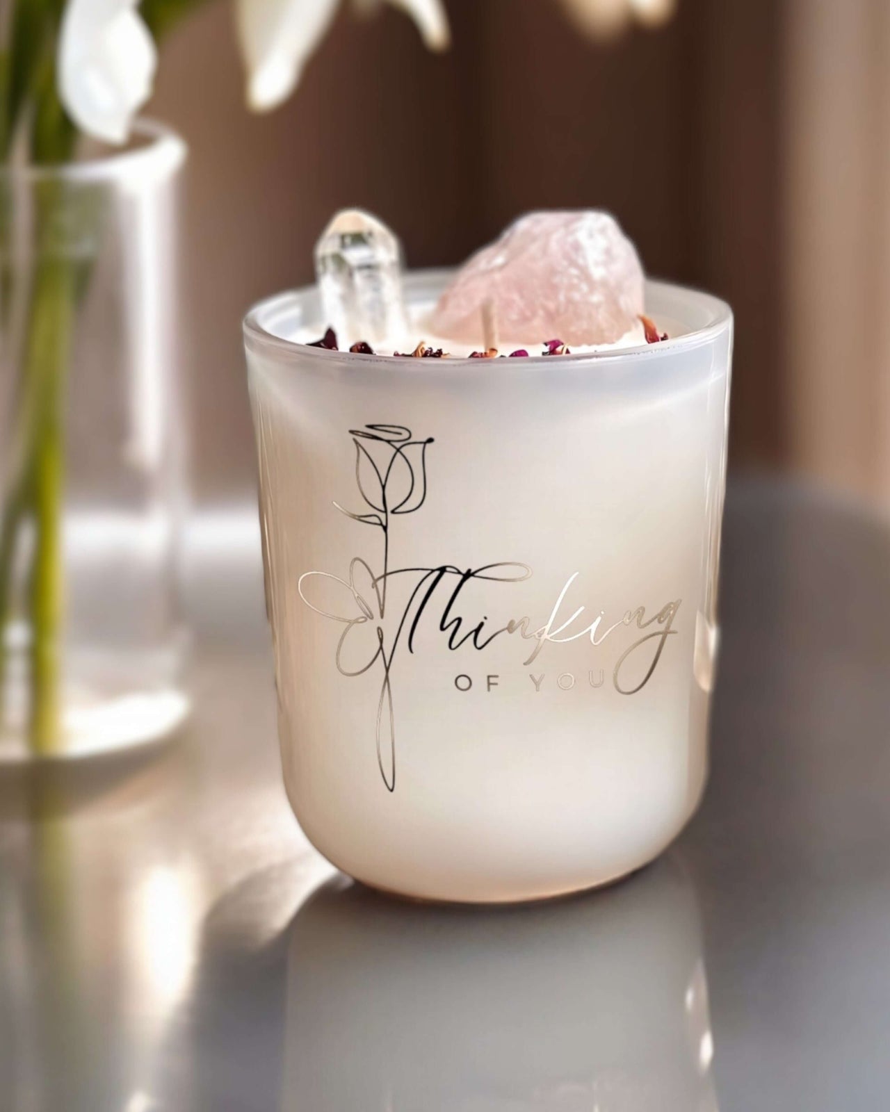 Thinking of you candle with Rose Quartz and Clear Quartz crystal gemstones inside.