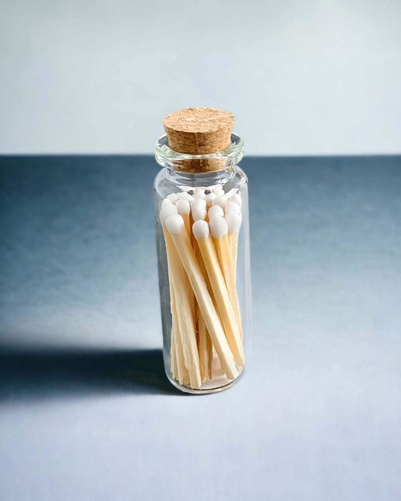 Stylish white multicoloured matches come in a mini apothecary jar