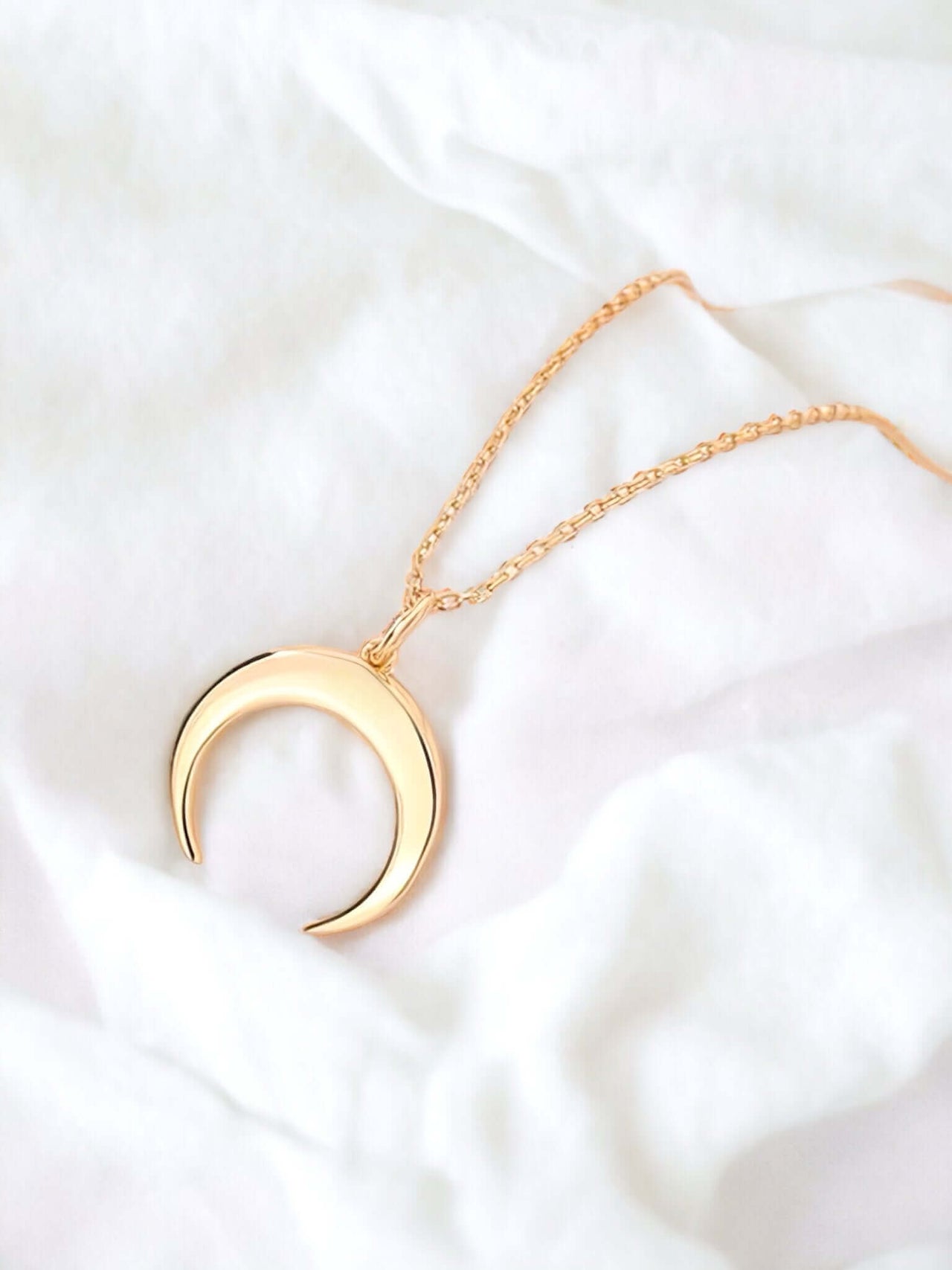 Elevate your style with our Gold Crescent Moon Necklace, a perfect blend of Sterling Silver