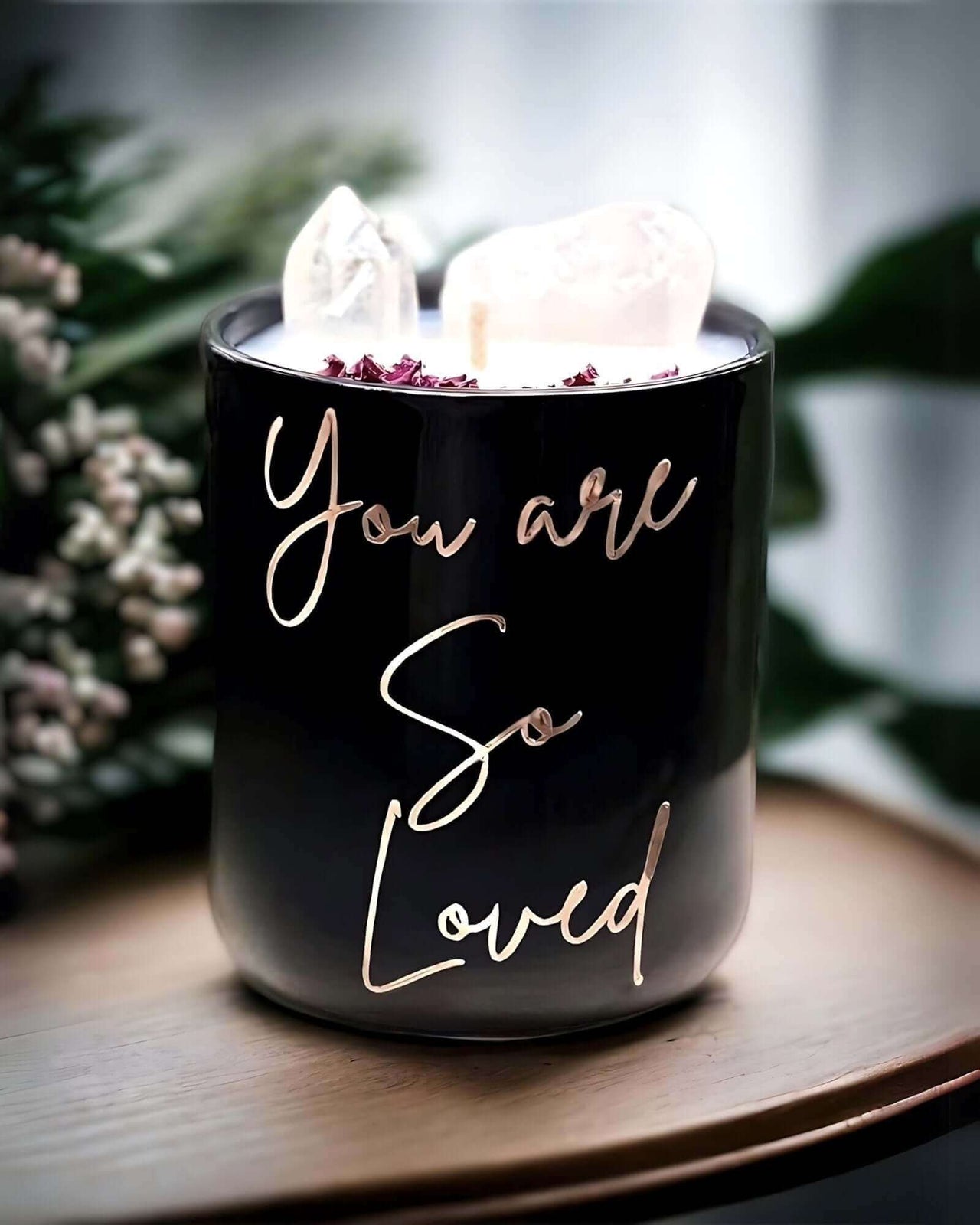 Elevate your sanctuary with our You are so loved candle, imbued with Rose Quartz for love, in chic black or white. Indulge in 50 hours of serenity.
